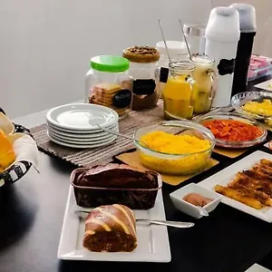  Quarto em Acomodações Particulares Na Praia Suítes